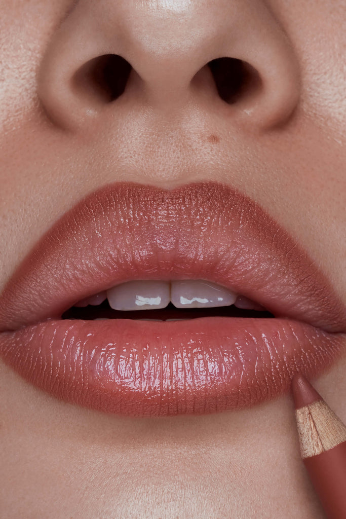 Feline lip liner shown on model's lips