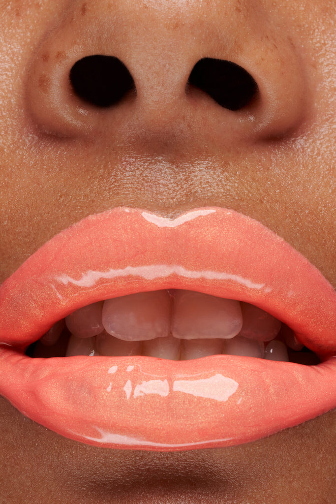 Bellini lip gloss shown on model's lips
