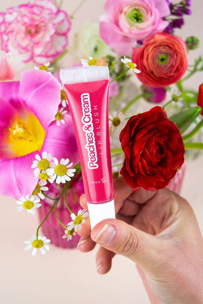 Poppy lip blush displayed with flowers