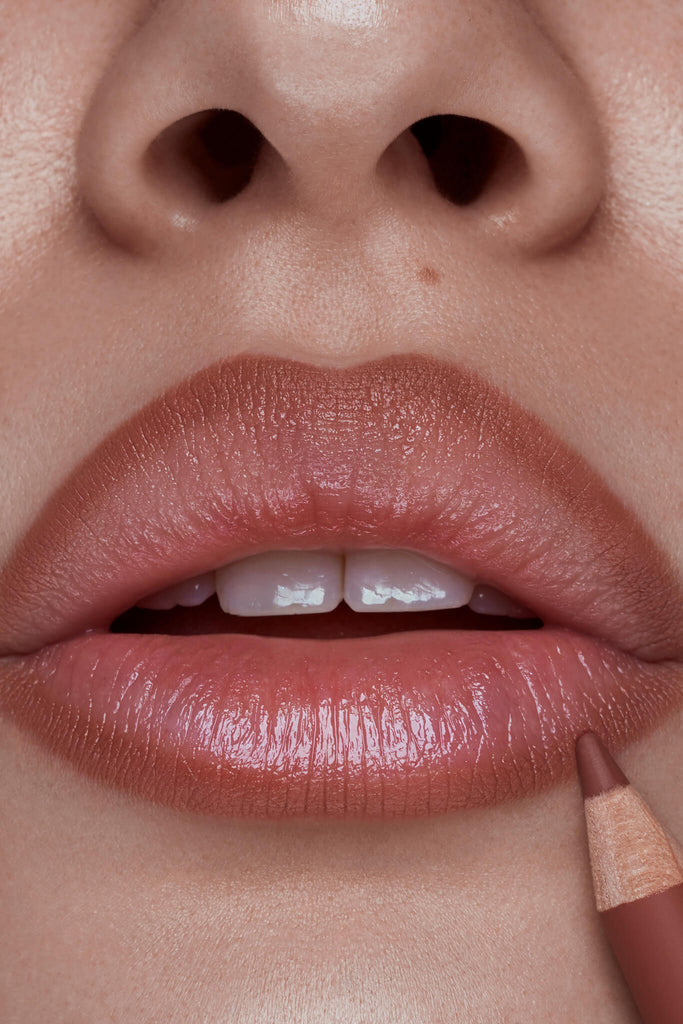 Borderline lip liner shown on model's lips