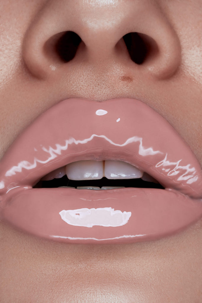 Back chat lip gloss shown on model's lips