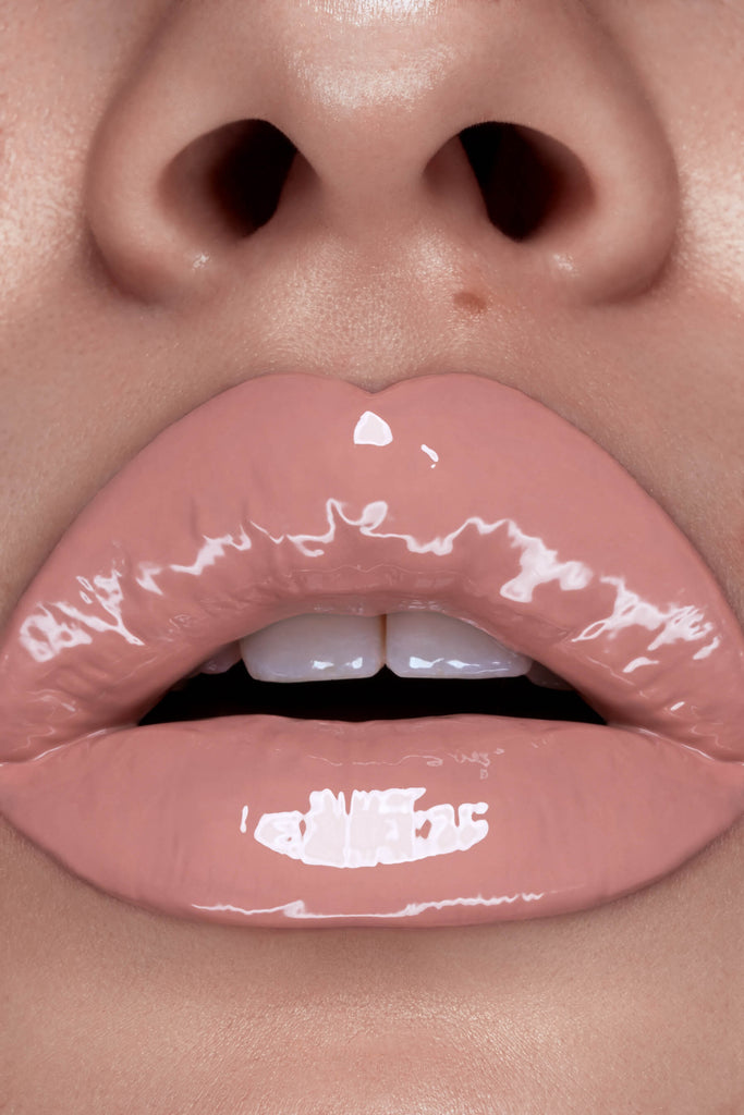 Cherub lip gloss shown on model's lips