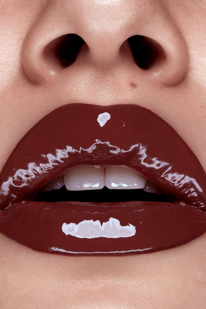Cherry Brandy lip gloss shown on model's lips