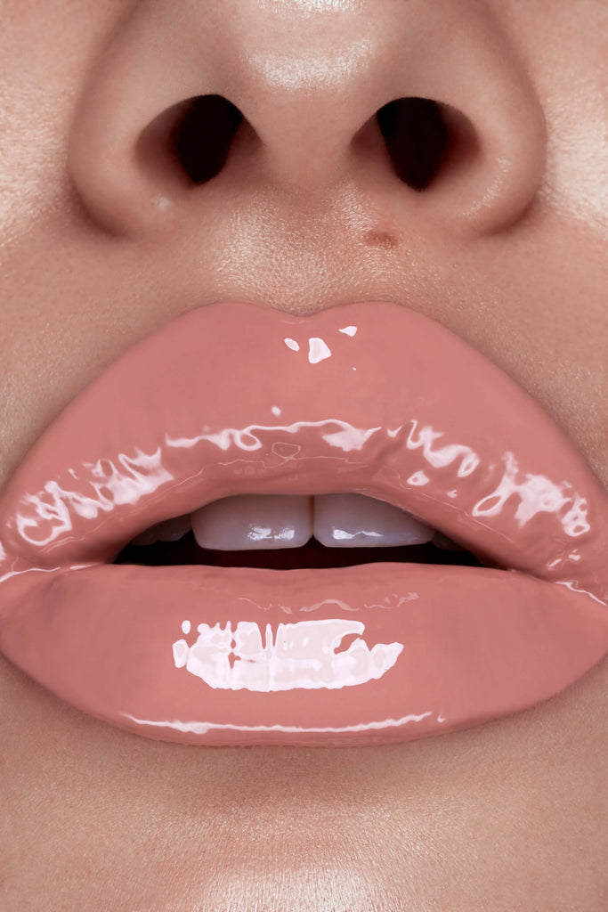 Tease lip gloss shown on model's lips
